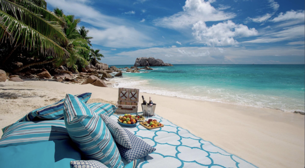Picnic on white sand beach in Seychelles
